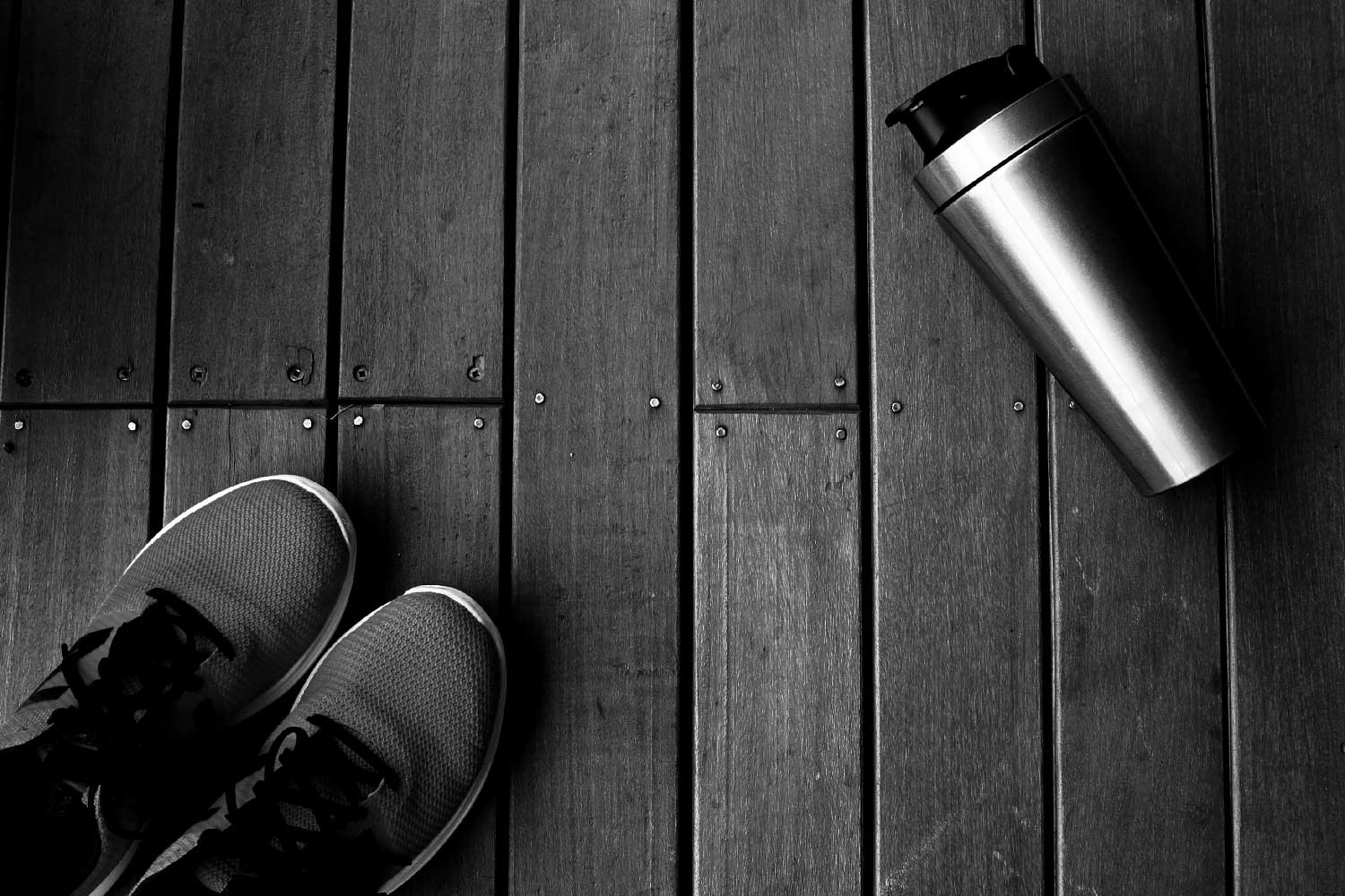 homepage background of gym shoes and a shaker bottle.